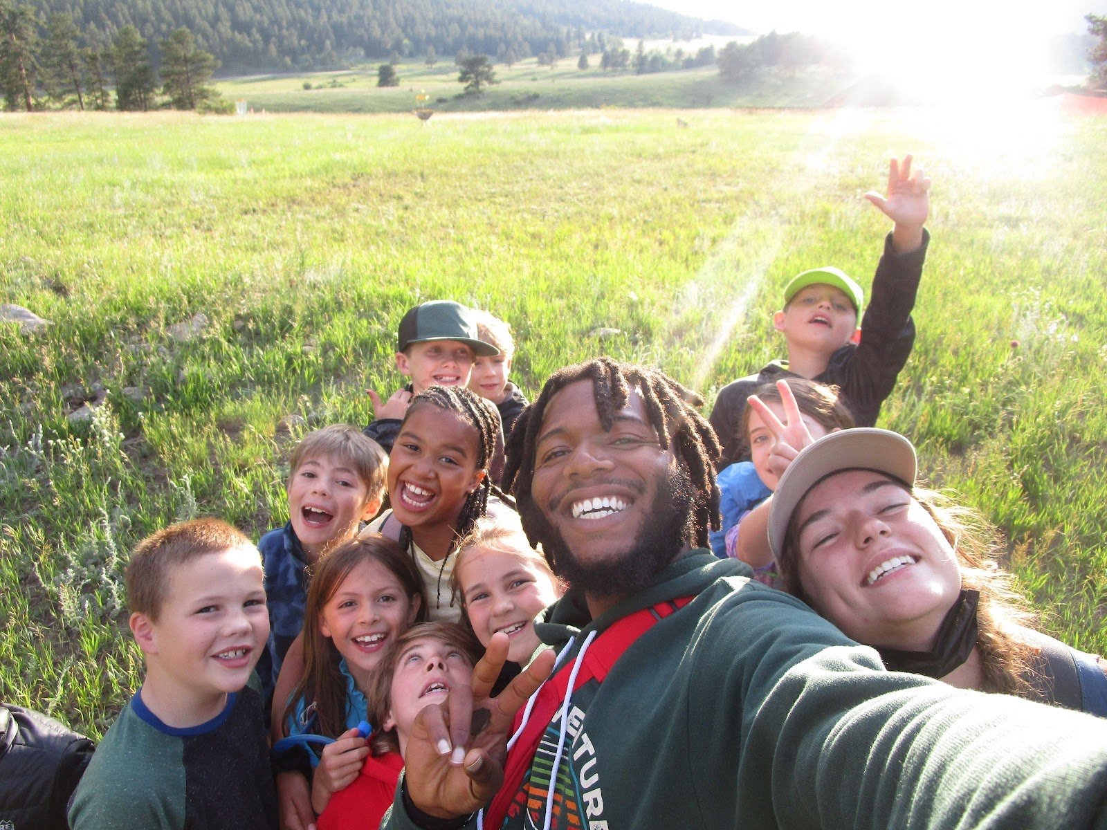 Instructor and Campers Huddle at Overnight Camp
