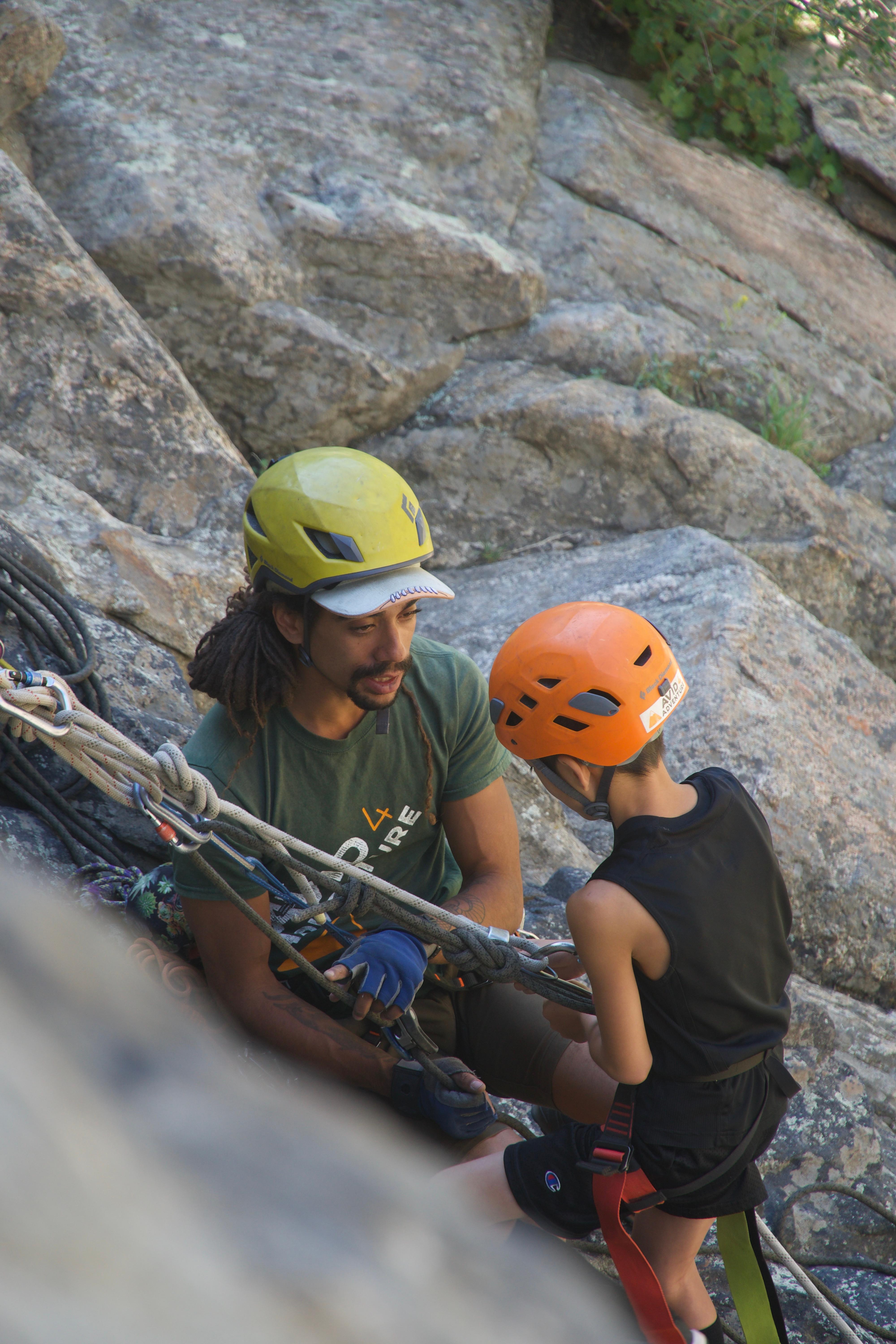 Climbing Instructor Works 1:1 with Camper
