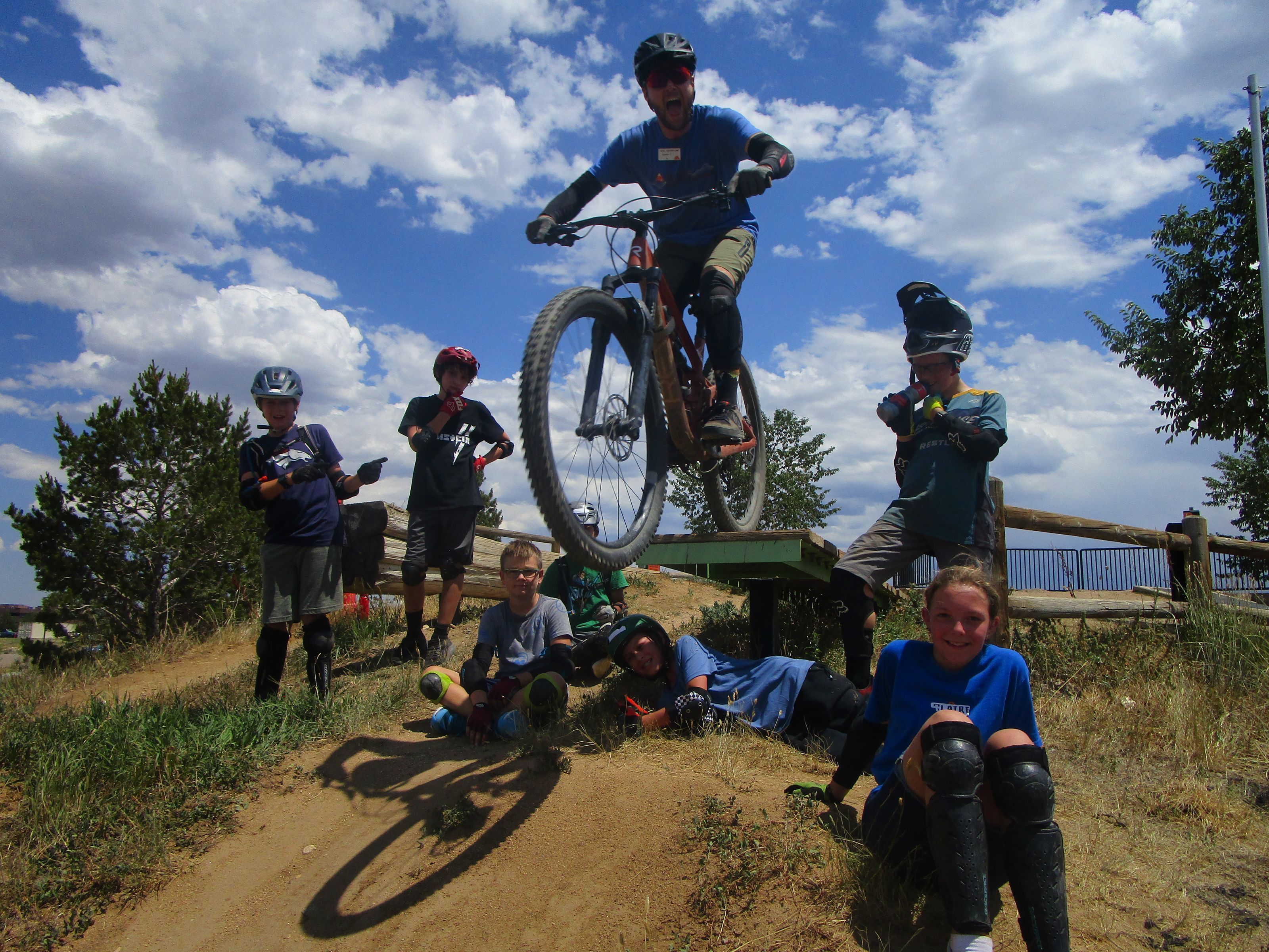Instructor Leaping Amidst Campers